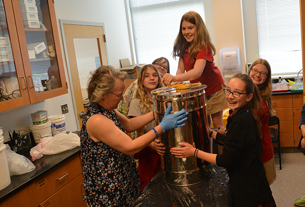 Students from private middle school in Fort Washington, PA learn how to extract honey in class